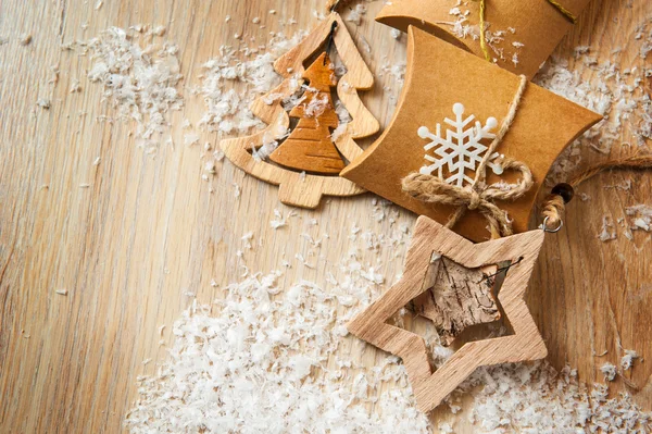 Christmas gifts in kraft paper with a homemade toys with snow — Stock Photo, Image