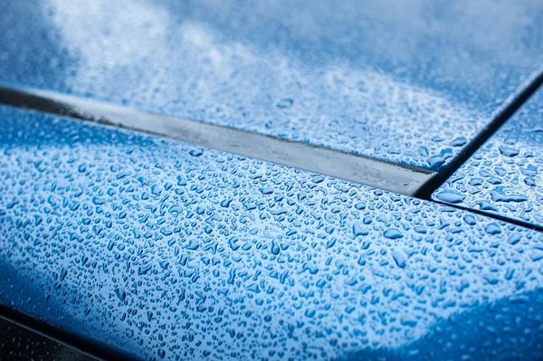 Rain drops on the hood of the car — Stock Photo, Image