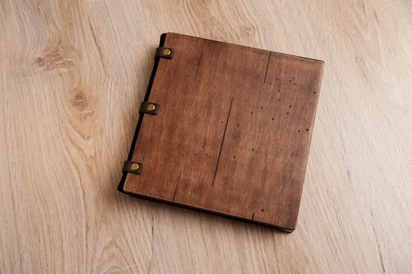 Wedding book with a wooden cover on a wooden texture — Stock Photo, Image