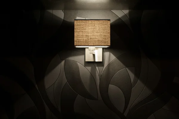 Included wall lamp in the bedroom at the evening — Stock Photo, Image