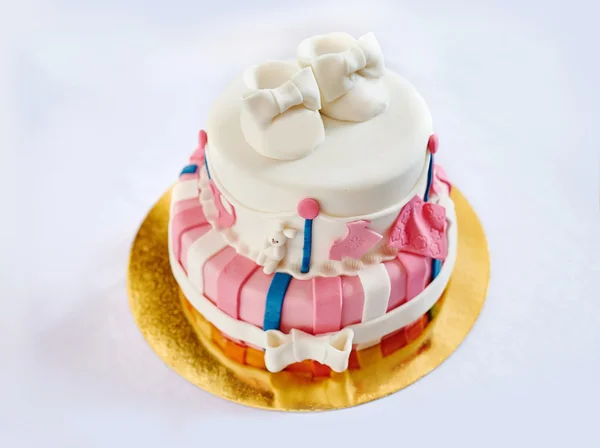 Two-layer cake for a child's birthday decorated shoes — Stock Photo, Image