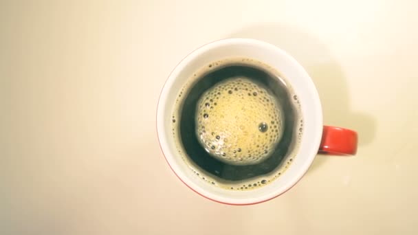 Cup of coffee on wooden table — Stock Video