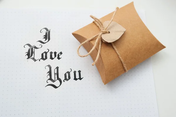 Text god bless you on paper texture and gift box with heart