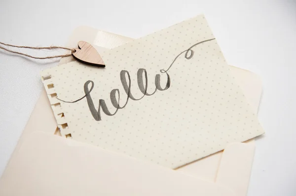 Calligraphic inscription hello and heart for greating card — Stock Photo, Image