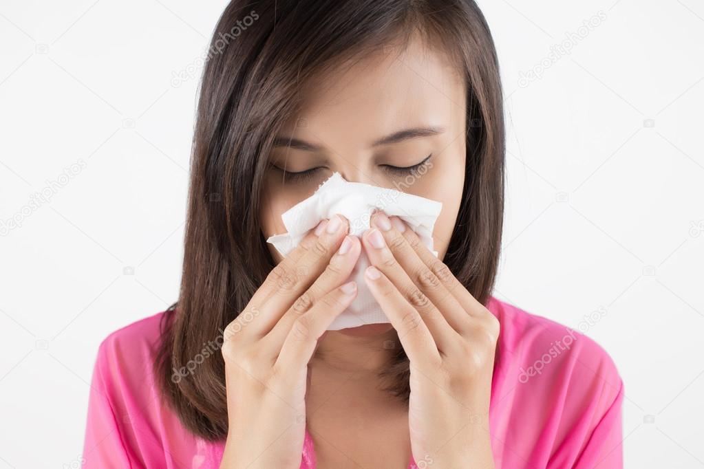 Flu cold or allergy symptom. Sick woman girl sneezing in tissue 