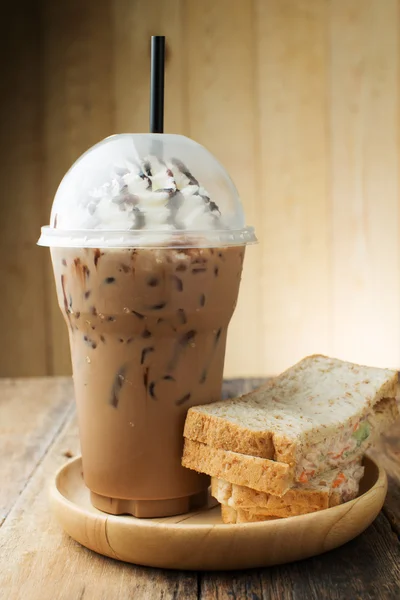 Iced coffee on wooden table — Stock Photo, Image