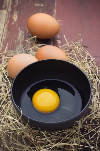 Fresh farm eggs on a wooden rustic background — Stock Photo, Image