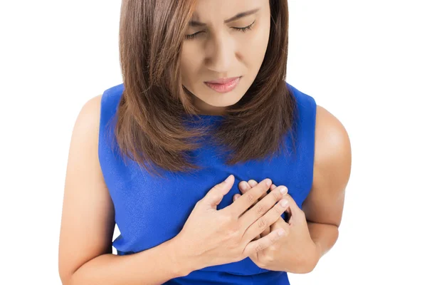 Woman is clutching her chest, acute pain possible heart attack — Stock Photo, Image