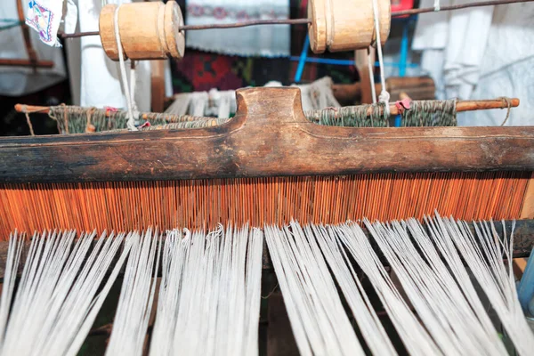 Ancient loom for making carpets . Manufacturing of weaving cloth and tapestry