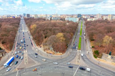 Traffic on the street in Berlin . Crossroads and Berlin city aerial view . Park and streets in Germany 