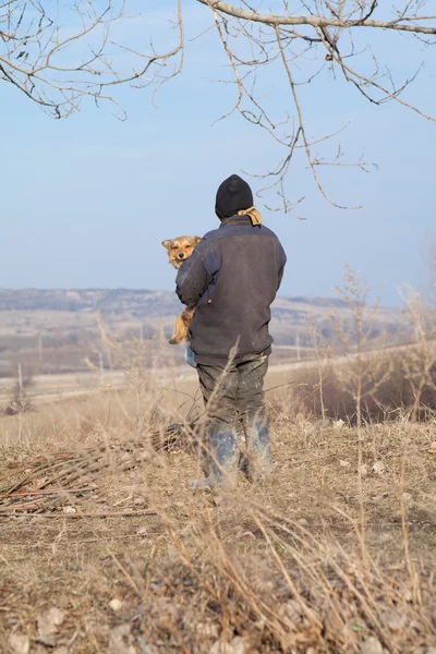 Man with abandoned animal — Stock Photo, Image