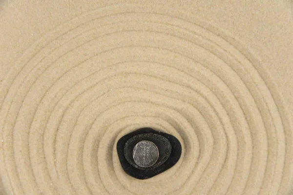 Zen sand garden meditation stone background with copy space. Stones and lines drawing in sand for relaxation. Concept of harmony, balance and meditation, spa, massage, relax. Set Sail Champagne color