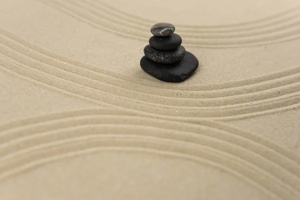 Zen sand garden meditation stone background with copy space. Stones and lines drawing in sand for relaxation. Concept of harmony, balance and meditation, spa, massage, relax. Set Sail Champagne color