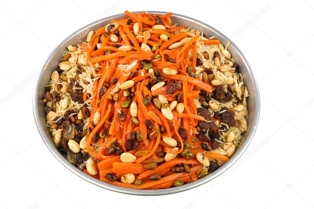   Delicious, colorful Afghan rice pilaf ( Kabuli Pilaf) with lamb or chicken meat and raisin, carrot, pistachio, almond, spices.                              