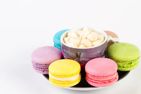 Collection of brightly colored French macaroon on the plate, white background — Stock Photo, Image