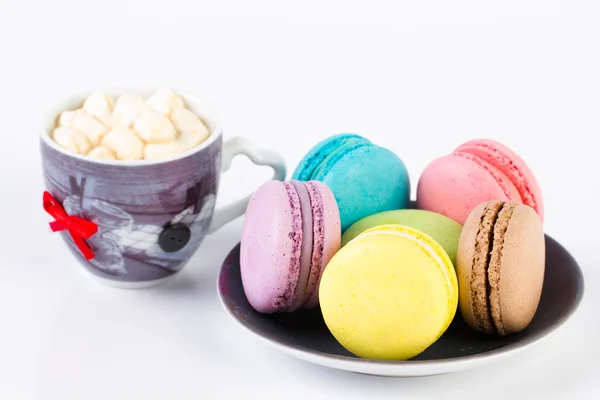 Collection of brightly colored French macaroon on the plate, white background — Stock Photo, Image