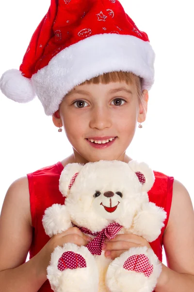 Girl in a red cap holding a toy in the hands, isolated Stock Photo