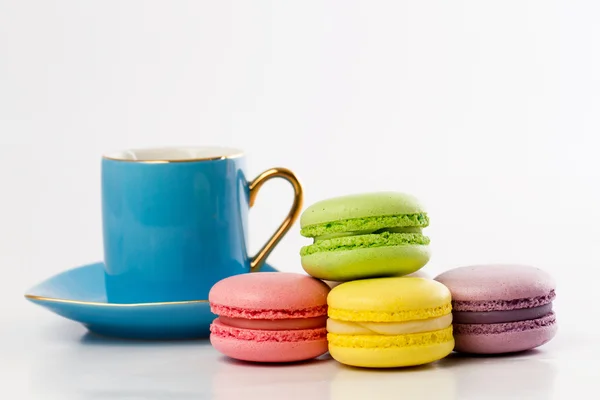 The colourful collection of French macarons, blue mug — Stock Photo, Image
