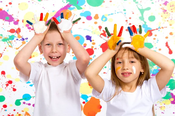 Boy and girl shows painted hands — Stock Photo, Image