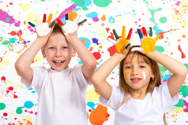 boy and girl shows painted hands