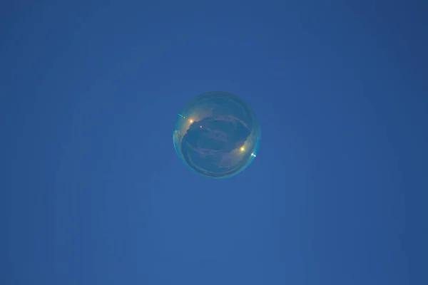 Flying Soap Bubble Reflective Rays Sun Blue Sky Background — Stock Photo, Image