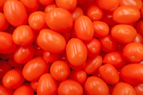 Hintergrundbild Eine Streuung Frischer Roter Reifer Kleiner Pflaumenkirschtomaten Der Neuen — Stockfoto