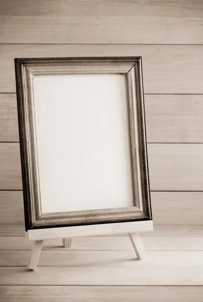 Picture frame on wood — Stock Photo, Image