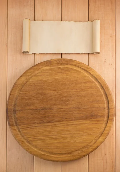 Cutting board on wood — Stock Photo, Image