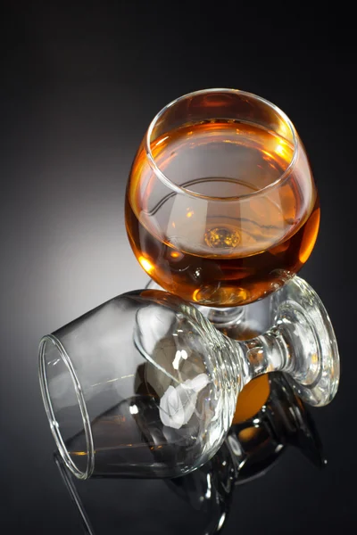 Cognac and  glass  on black — Stock Photo, Image