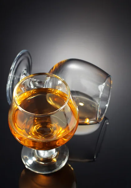 Cognac and  glass  on black — Stock Photo, Image