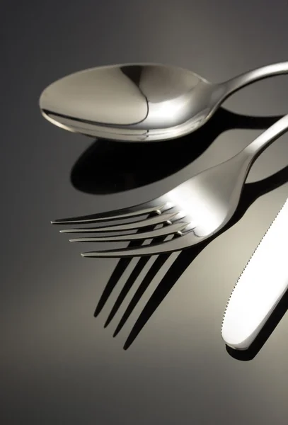 Knife, spoon and fork on black — Stock Photo, Image