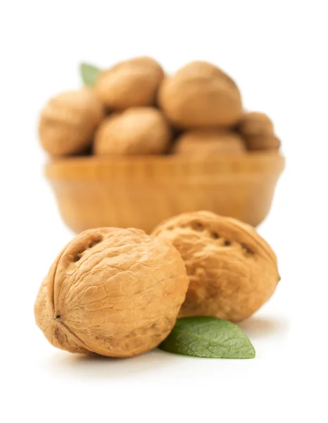 Walnuts in bowl on white — Stock Photo, Image