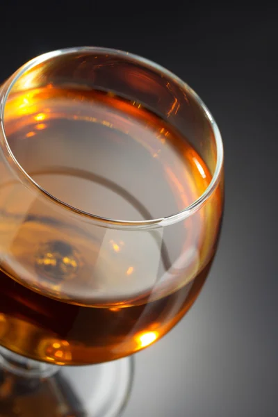 Cognac and  glass  on black — Stock Photo, Image