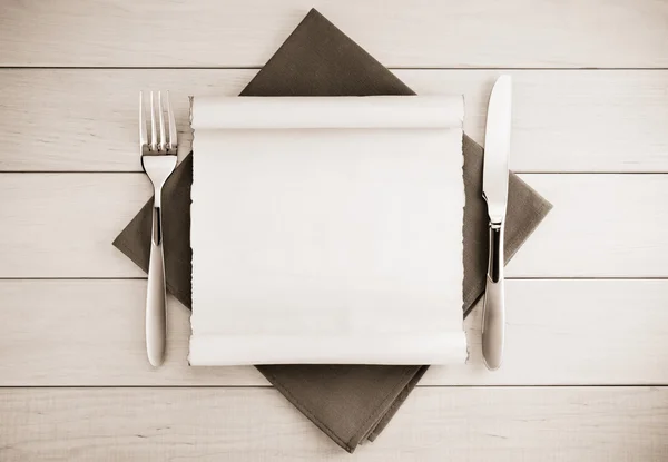 Parchment and napkin on wood — Stock Photo, Image