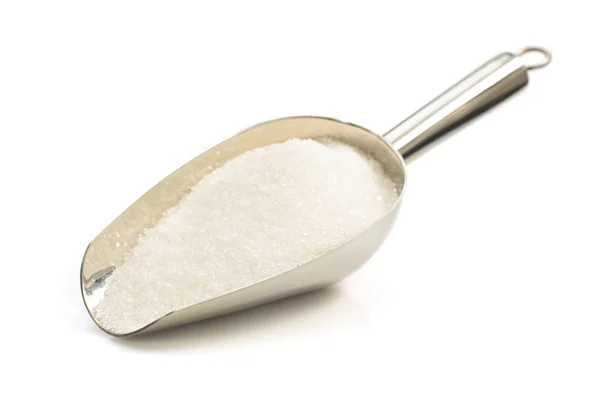 Granulated sugar in scoop on white — Stock Photo, Image