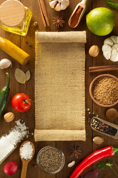 Herbs and spices on wood background — Stock Photo, Image