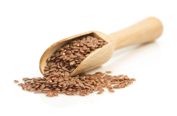 Flax seeds in scoop on white — Stock Photo, Image