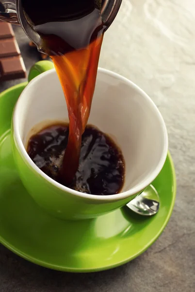 pouring coffee in cup