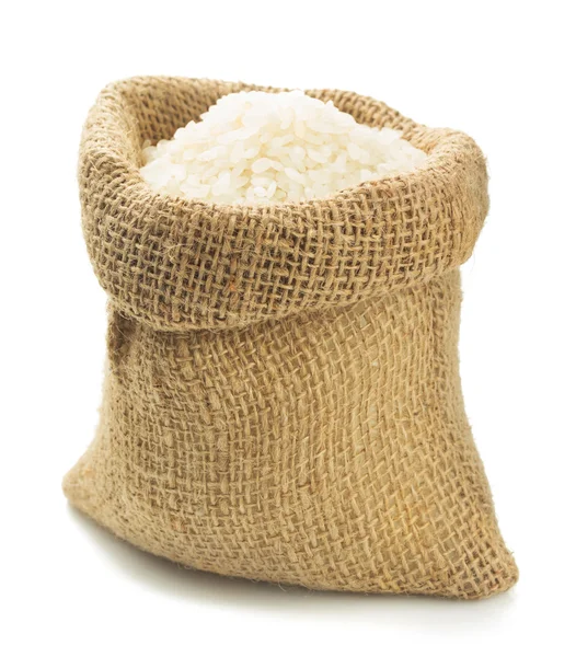 Рис в мешке на белом — стоковое фото