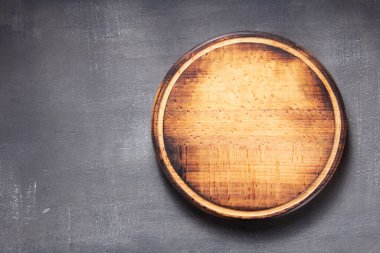 pizza cutting board at  table or wall, with stone background texture