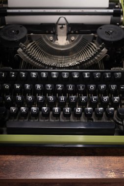 vintage typewriter at wooden table, abstract retro writer concept
