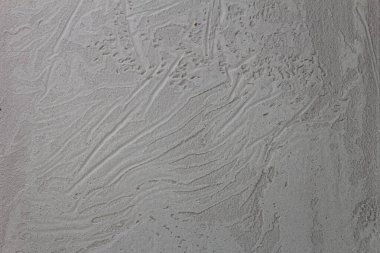 Duvar dokusu olarak beton ya da alçı arka plan. Kopya alanı olan gri ya da gri taş arkaplan