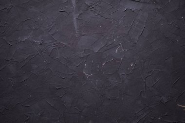 Soyut siyah duvar arkaplan dokusu. Fotokopi alanı olan macun duvarının beton veya alçı yüzeyi