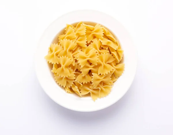 Pasta Farfalle Eten Bord Witte Achtergrond Rauwe Pasta Italiaans Eten — Stockfoto