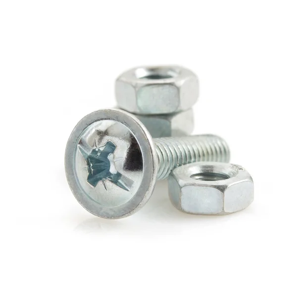 Metal screws and nut tool on white — Stock Photo, Image