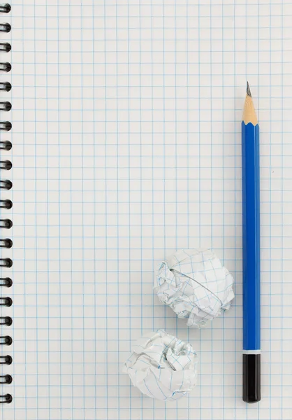 Pencil at checked paper — Stock Photo, Image