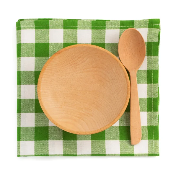 Wooden plate at checked napkin — Stock Photo, Image