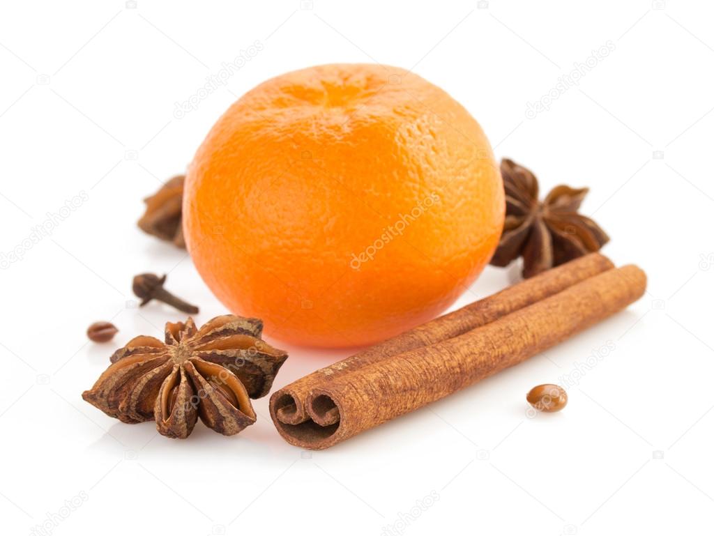 Mandarin and spices on white