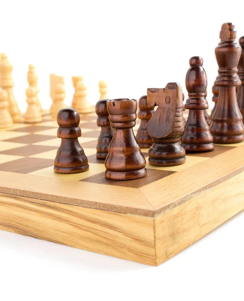 Chess figures on board at white — Stock Photo, Image