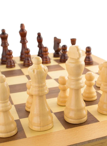 Chess figures on board at white — Stock Photo, Image